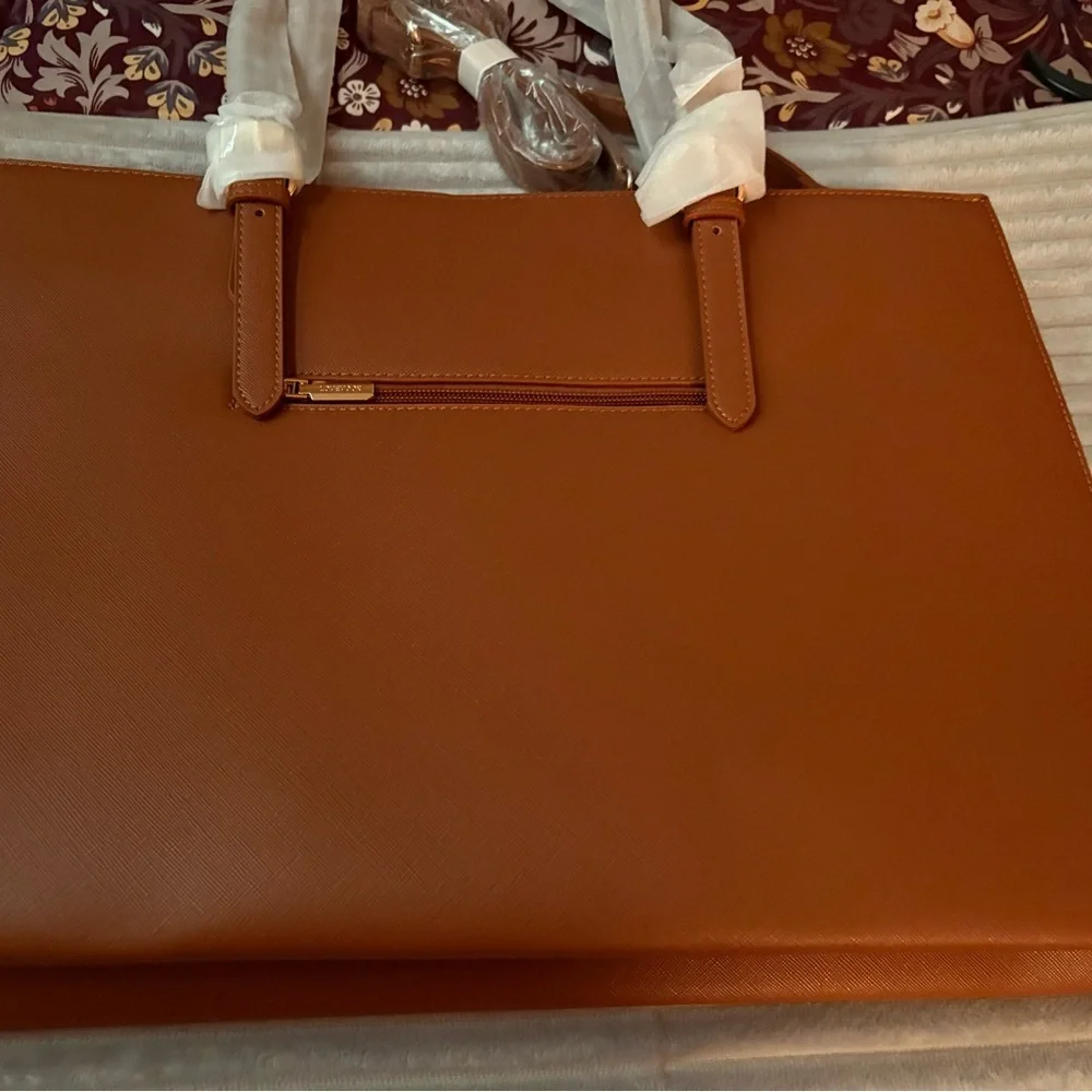 Elegant Tan faux leather Tote Bag Never used . Great for business and travel -